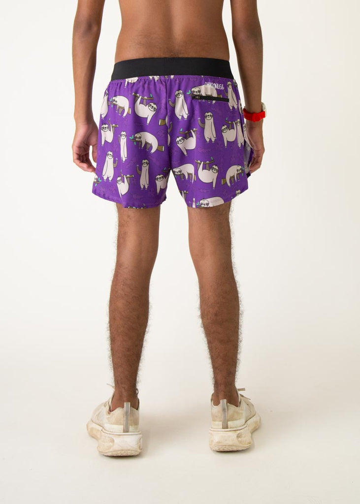 The model is a runner who is wearing Chicknlegs men's 4 inch split running shorts in the sloth design, facing away from the camera to show the back of the shorts.