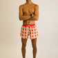 Full body shot of runner wearing the ChicknLegs Strawberry Szn 4 inch running shorts.