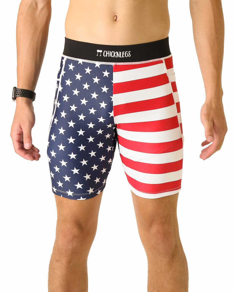 Runner is wearing ChicknLegs in the men's 8 in half tights with pockets in the USA State Flag design. The print has red, white and blue on it with stars. Great for running for people who love America.