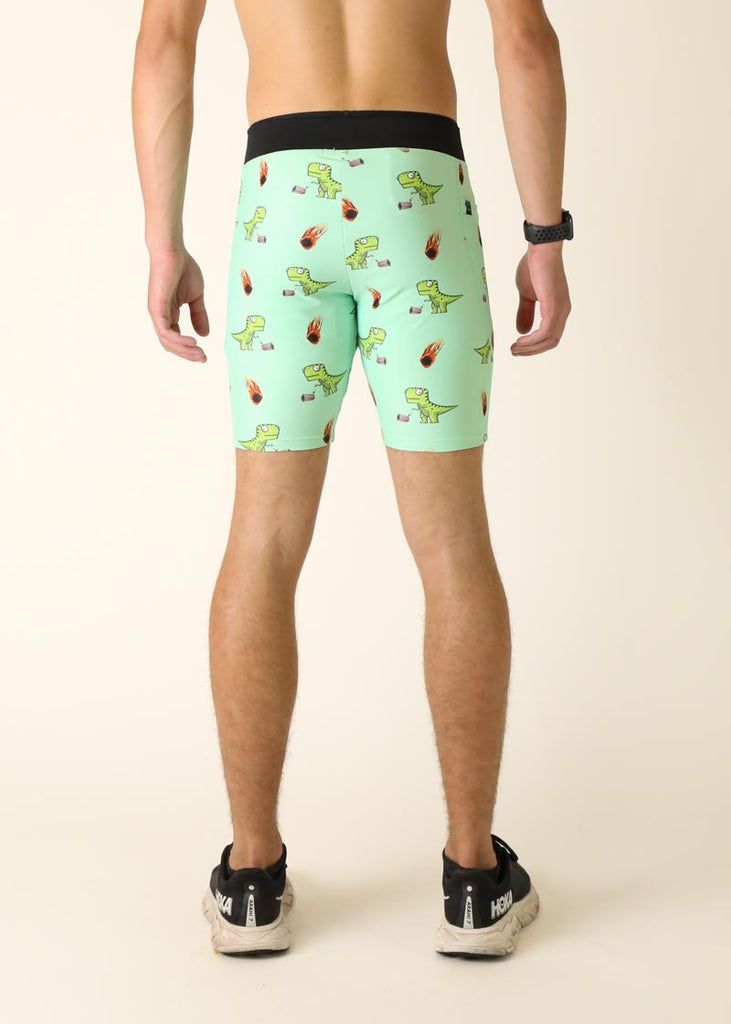 Model wearing Chicknlegs men's 8 inch half tights in the dino's design facing back for behind shot.