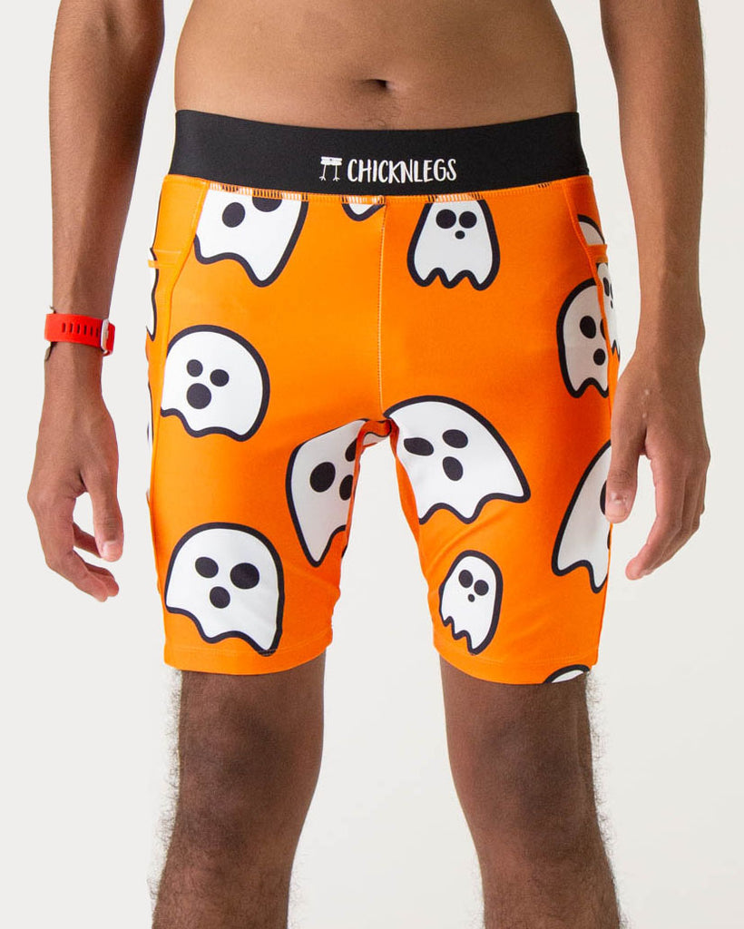Model is a runner wearing Chicknlegs men's 8 inch half tights in the Ghosts design, facing front and a close up is shown.