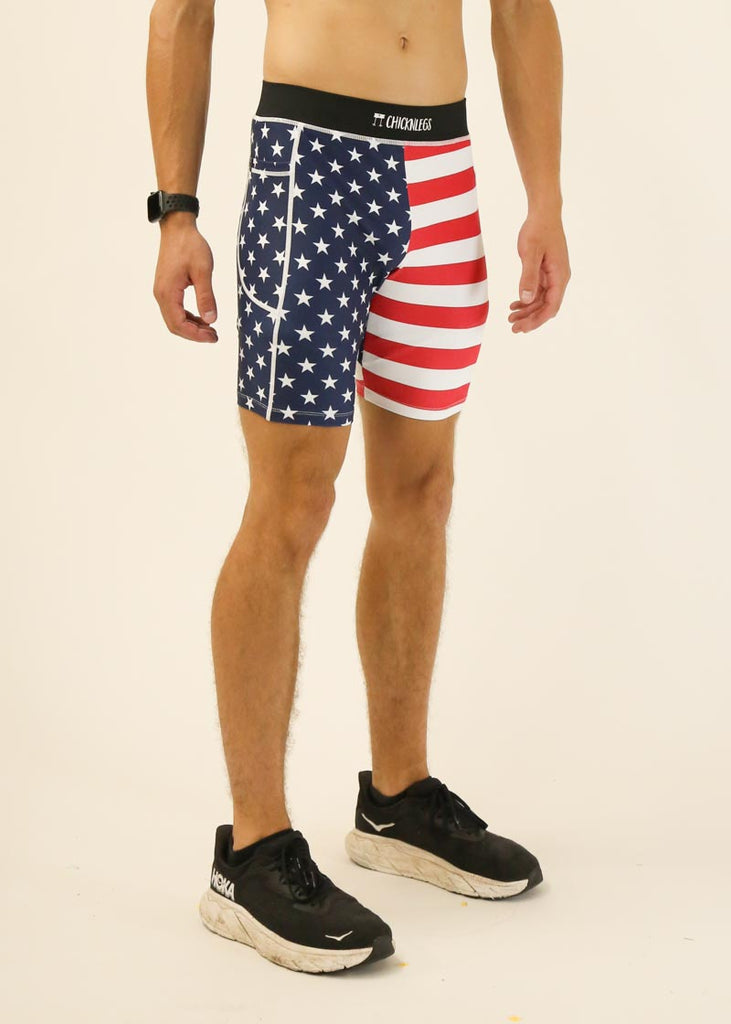 Model wearing Chicknlegs men's 8 inch half tights in the USA design facing right for side view.
