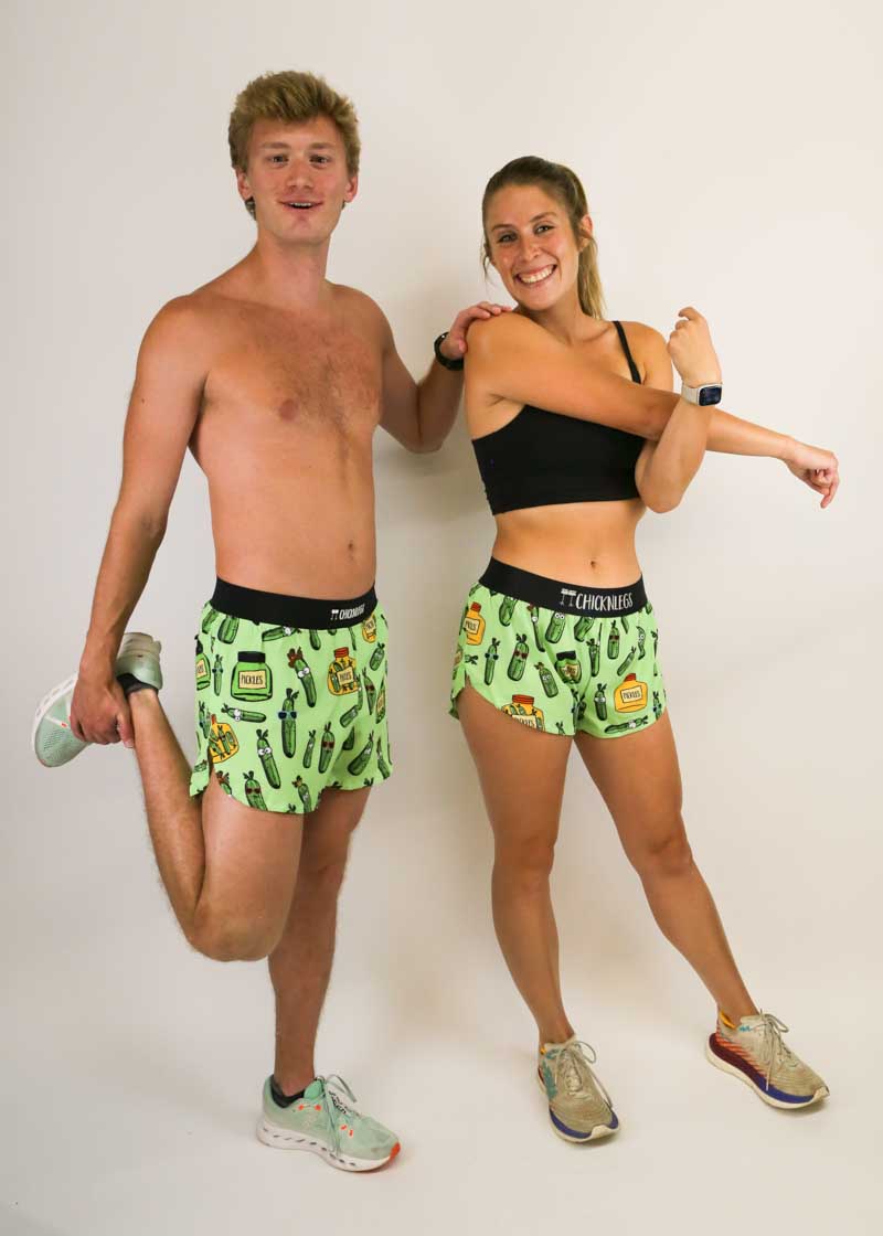 Group photo of two runners wearing the men's and women's pickle running shorts from ChicknLegs.