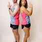Group photo of runners doing James Bond pose while wearing the blue flamingo performance singlets.