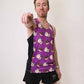 Runner pointing to camera while wearing the men's black split shorts and choccy cows performance running singlet.