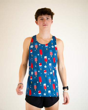 Runner is wearing ChicknLegs men's performance singlet in the USA Popsicle design, facing front. The print has red, white and blue ice cream on it with stars.