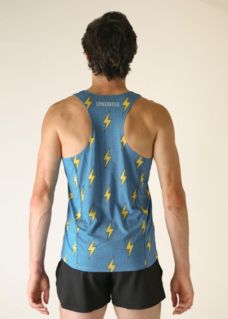 Model wearing Chicknlegs men's performance singlet wearing blue bolts design back view.