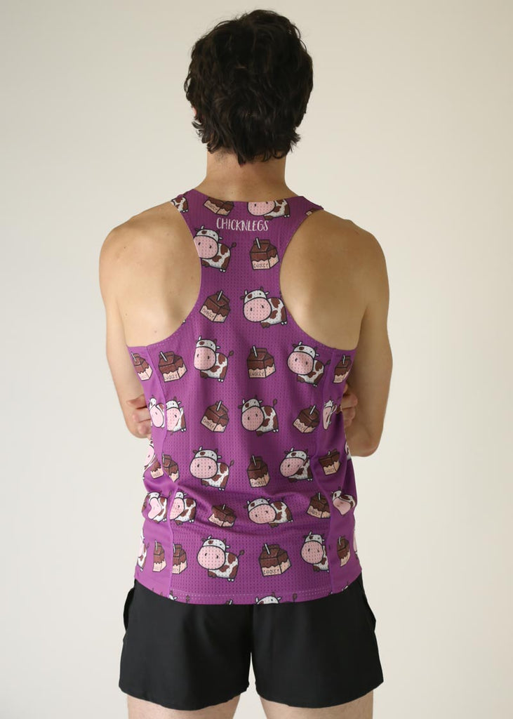 Model wearing chicknlegs men's performance singlet in choccy cow design back side view.