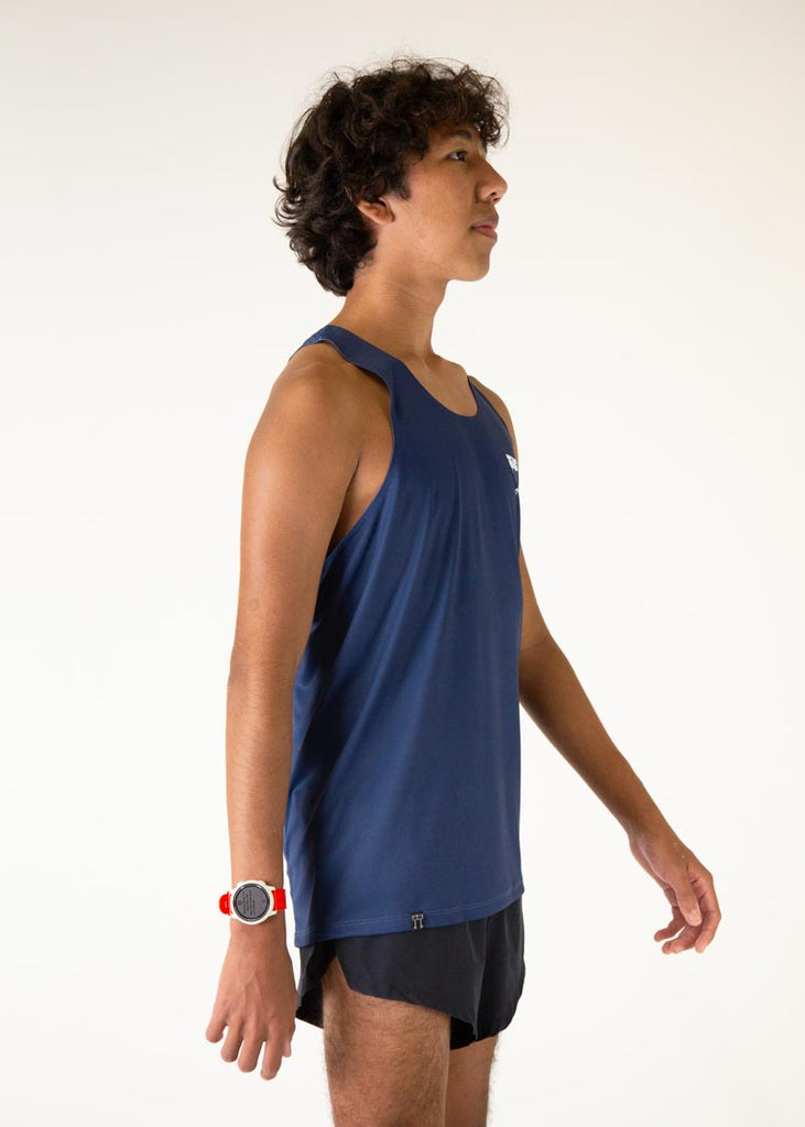 The model is a runner who is wearing Chicknlegs men's running performance singlet in the navy design, facing right.