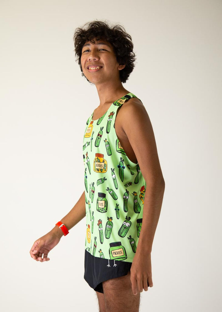 The model is a runner who is wearing Chicknlegs men's running performance singlet in the pickles design, facing left.