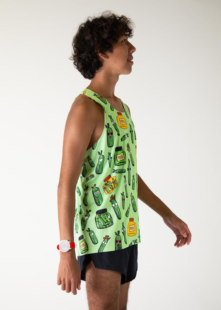 The model is a runner who is wearing Chicknlegs men's running performance singlet in the pickles design, facing right to view the side more.