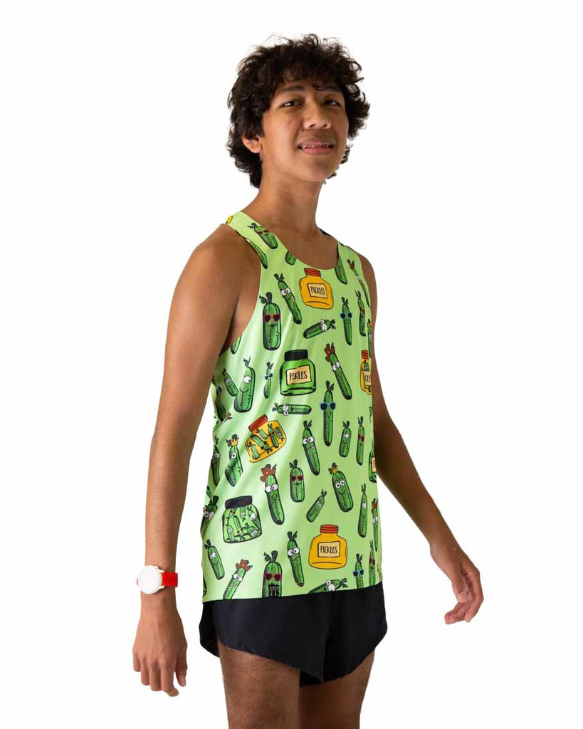 Runner is wearing ChicknLegs in the men's running performance singlet in the pickles design. The print has green background with pickles and a yellow and green jar.