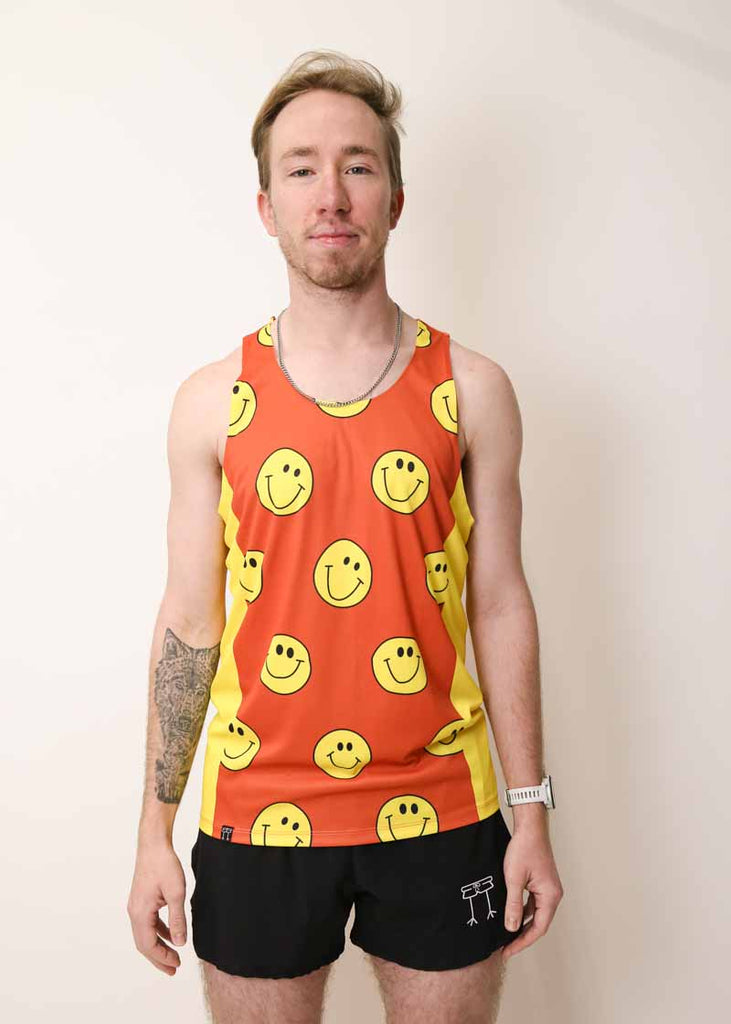 Front view of the men's smiley face performance running singlet from ChicknLegs.