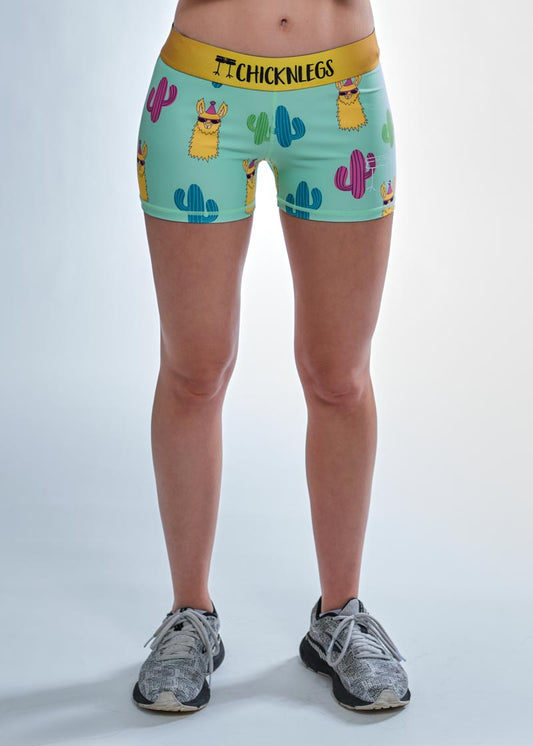 Front closeup view of the women's 3 inch compression running shorts with a green llamas design by ChicknLegs.