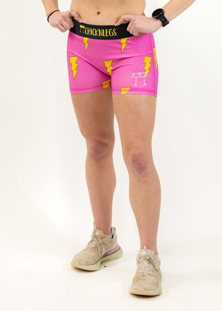 Front view of the women's 3 inch pink bolts compression running shorts from ChicknLegs.