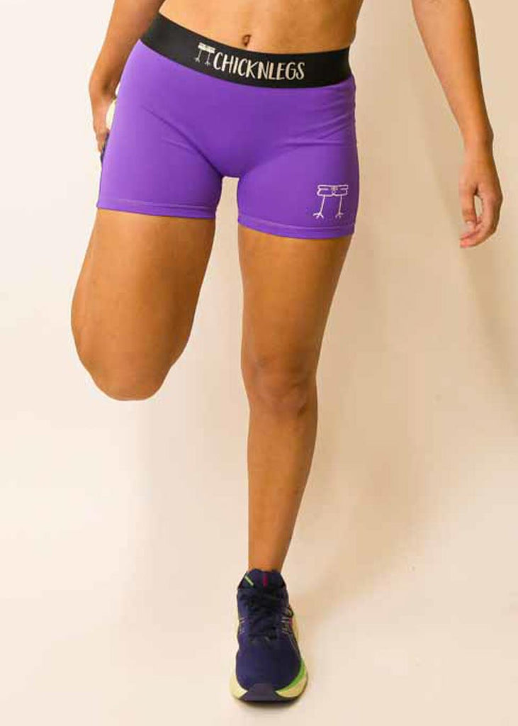 Front view of the women's purple compression running shorts from ChicknLegs.