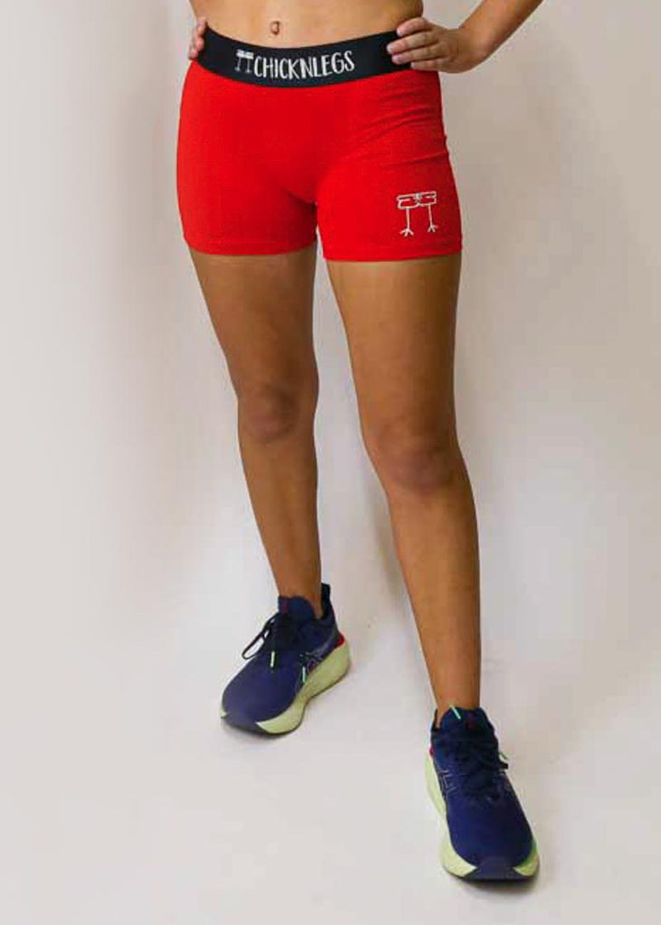 Front view of the women's red compression running shorts from ChicknLegs.