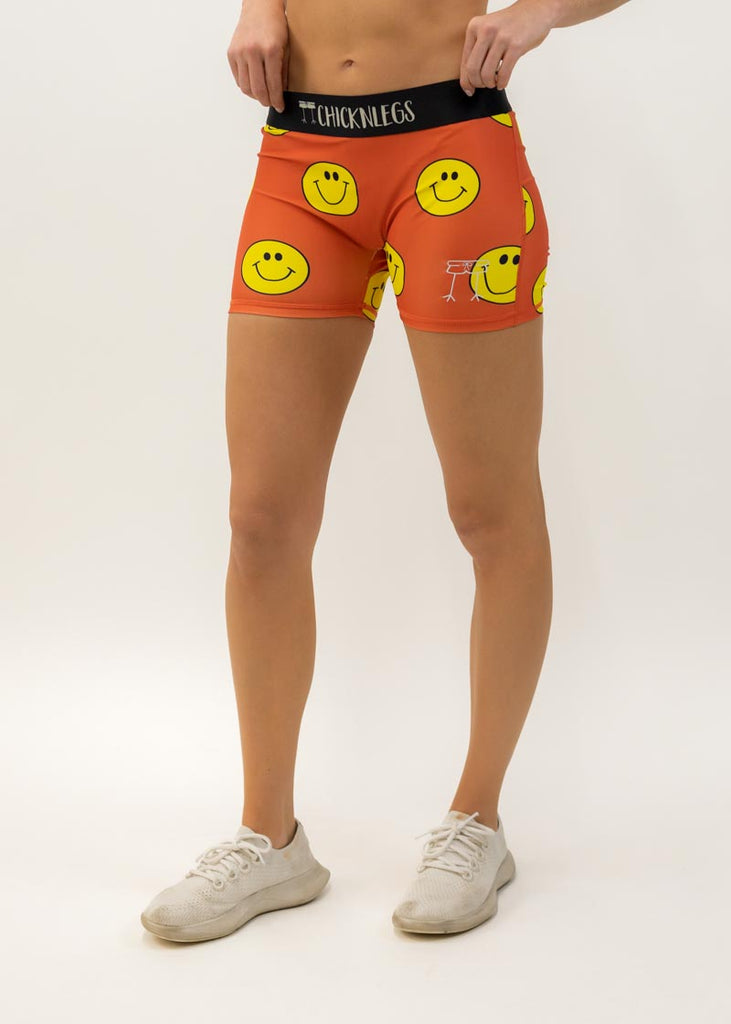 Front view of the women's smiley face 3 inch compression running shorts from ChicknLegs.
