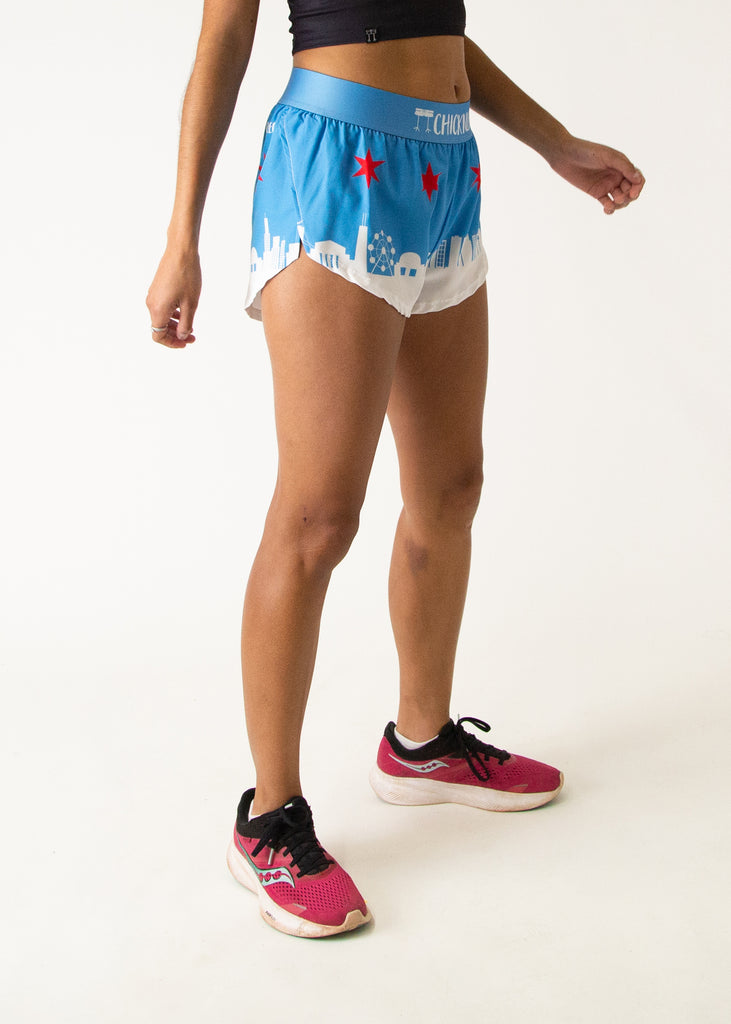 Runner is wearing ChicknLegs women's 1.5 in split running shorts in the Chicago  Style Skyline athletic shorts. It has the city and stars on it that is great for marathon and not chaffing. 