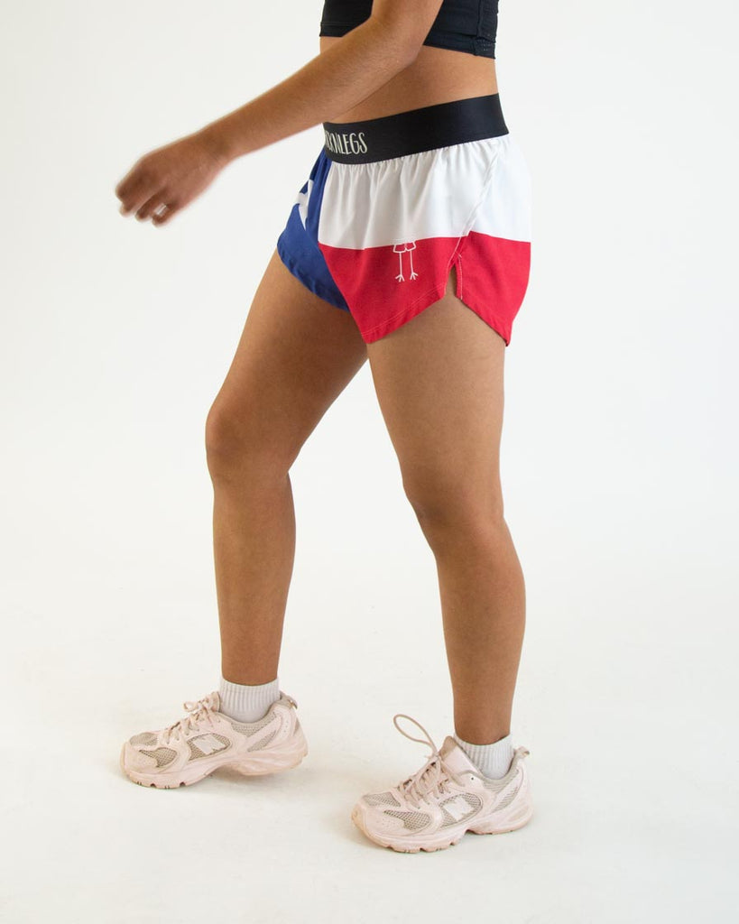 Runner is wearing ChicknLegs in the women's 1.5 in split running shorts in the texas flag print. It has blue, red and a white star on it.