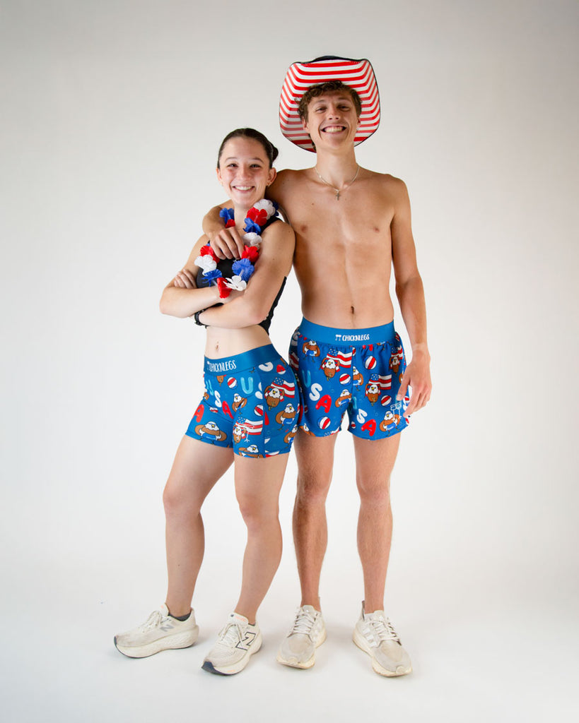 Runners are wearing the women's 3 in compression spandex shorts, and the men's 4 in split running short in the USA Pool party design. The print has bald eagles on it, american flags, USA colors such as red white and blue all over it.