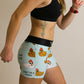 Side view of the 3 inch compression running shorts with a swaggy chickns design.