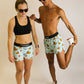 Runners stretching while wearing shades and the swaggy chickens running shorts.