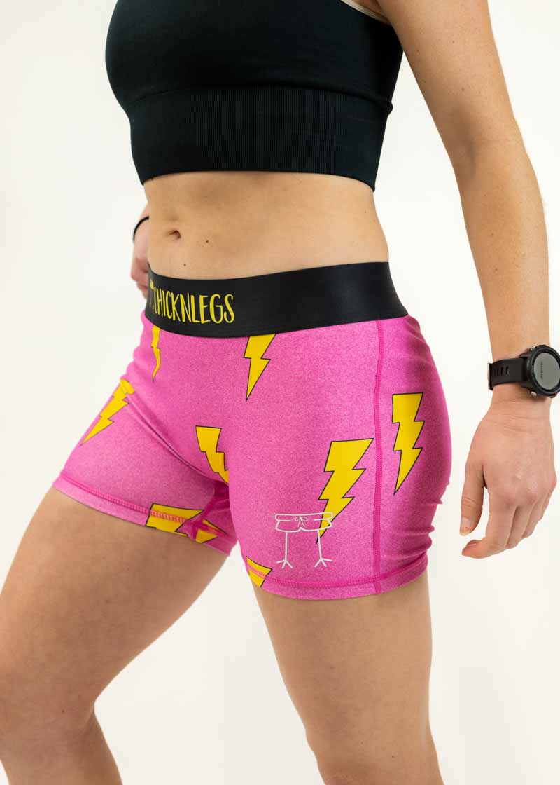 Left side view of the 3 inch pink bolts compression shorts from ChicknLegs.
