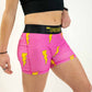 Right side view of runner wearing the 3 inch pink bolts compression shorts from ChicknLegs.