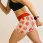 Left side view of the women's 3 inch strawberry compression running shorts from ChicknLegs.