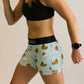 Side view of the women's 3 inch swaggy chickens compression shorts.