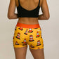 Back view of the orange traffic cone compression shorts from ChicknLegs.