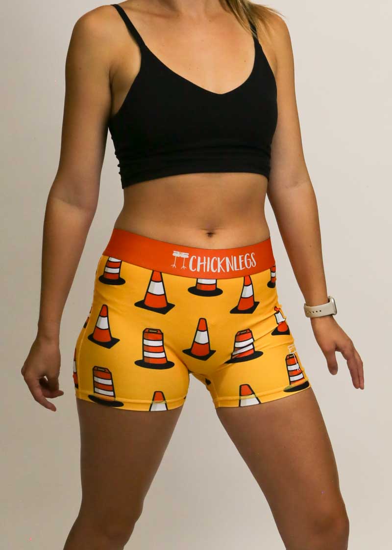 Side view of the women's 3 inch compression traffic cone shorts from ChicknLegs.