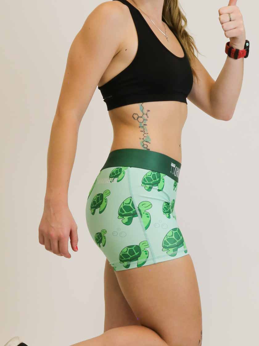 Side view of the women's 3 inch compression running shorts with a sea turtles design.