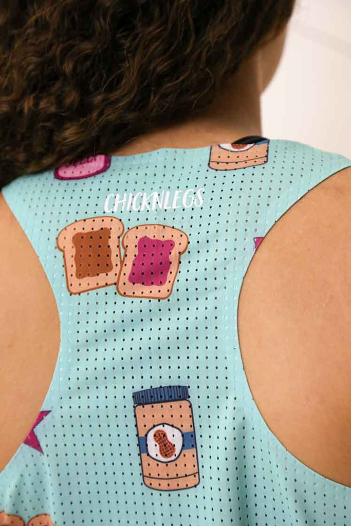 Closeup view of the back mesh paneling on the women's PB&J performance singlet.