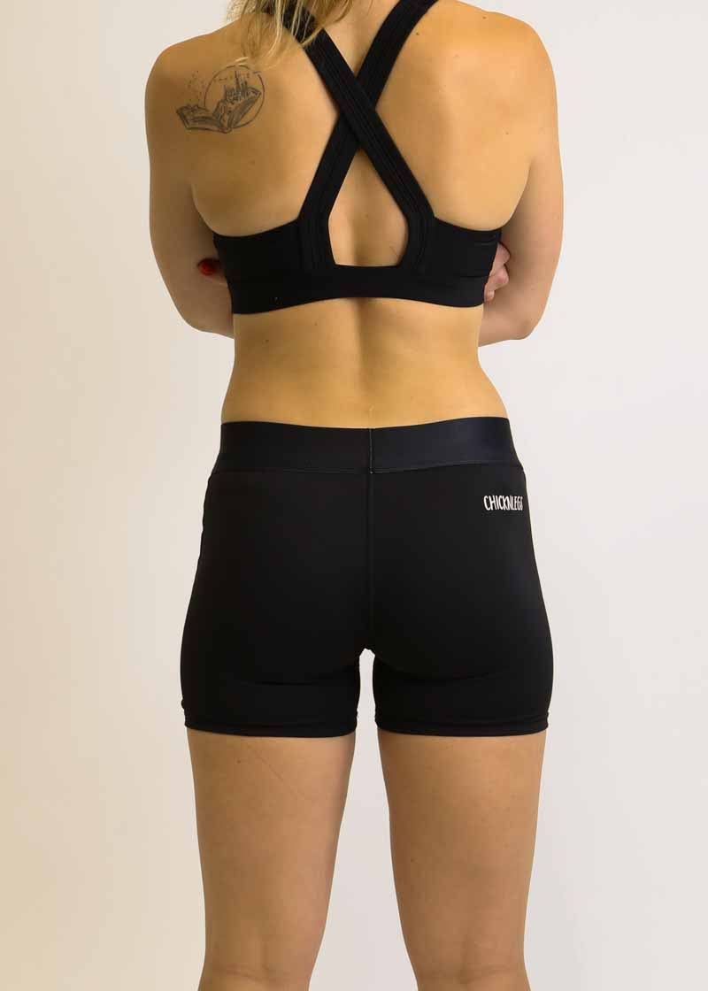 Rear view of the ChicknLegs 3 inch compression shorts in black.