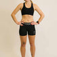 Full body view of runner wearing ChicknLegs black compression shorts.