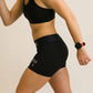 Left side view of runner wearing the women's 3 inch black compression shorts from ChicknLegs.
