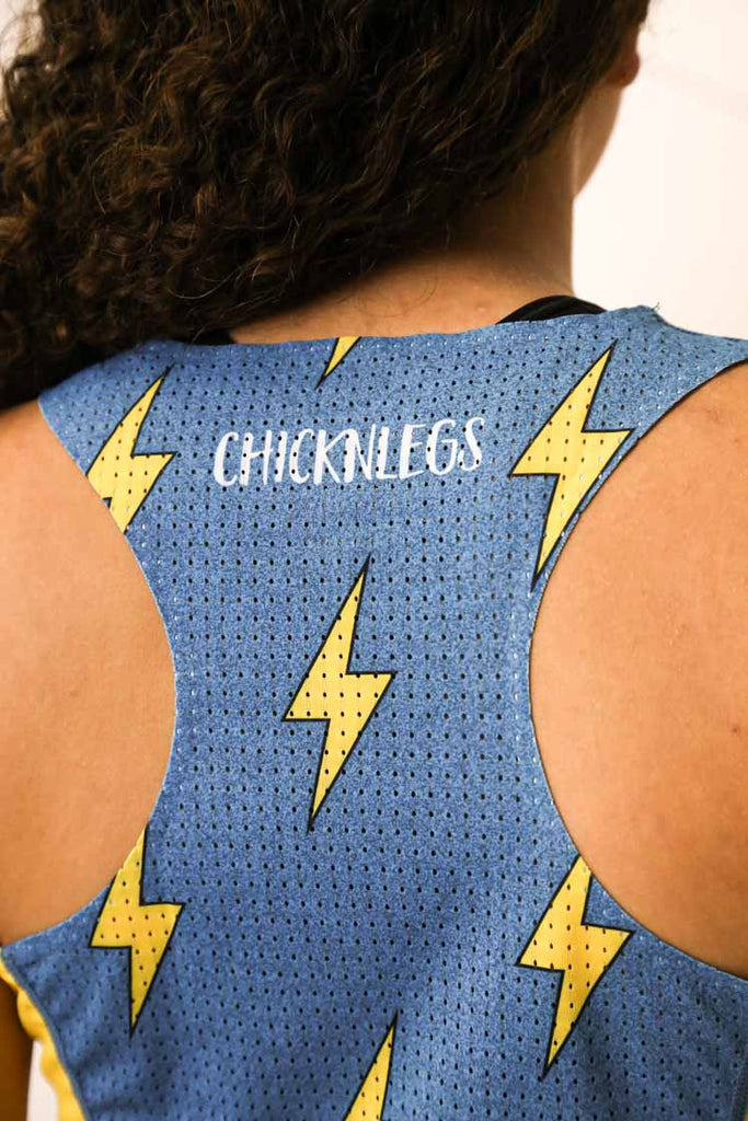 Closeup view of the back mesh paneling of our women's blue bolts performance singlet.