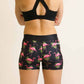 Back view of runner wearing the flamingo compression shorts from ChicknLegs.