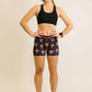 Full body view of runner wearing the flamingo compression shorts from ChicknLegs.