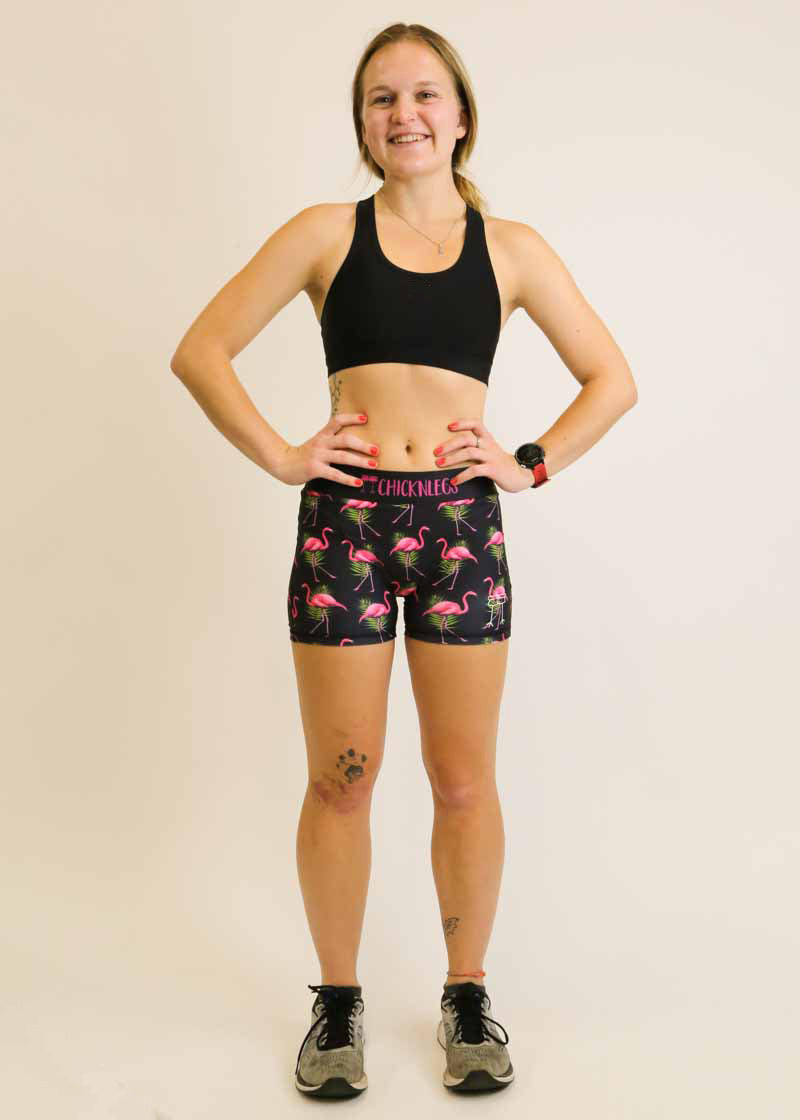 Full body view of runner wearing the flamingo compression shorts from ChicknLegs.
