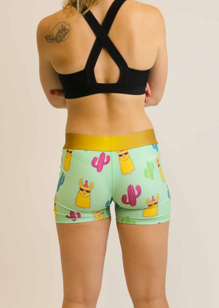 Back view of the women's green llamas 3 inch compression running shorts.