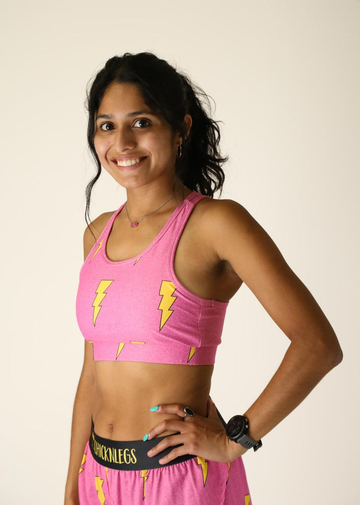 Side view of the pink bolts OG running sports bra.