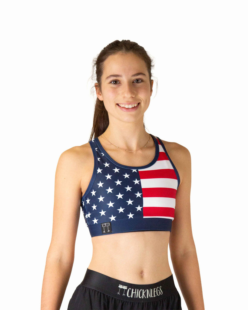 Runner is wearing ChicknLegs in the women's OG Sports Bra has a back pocket for exercise, running, workout, gym, and every day lifestyle. The print is the USA State Flag design, great for runners who want to celebrate America or fourth of july.