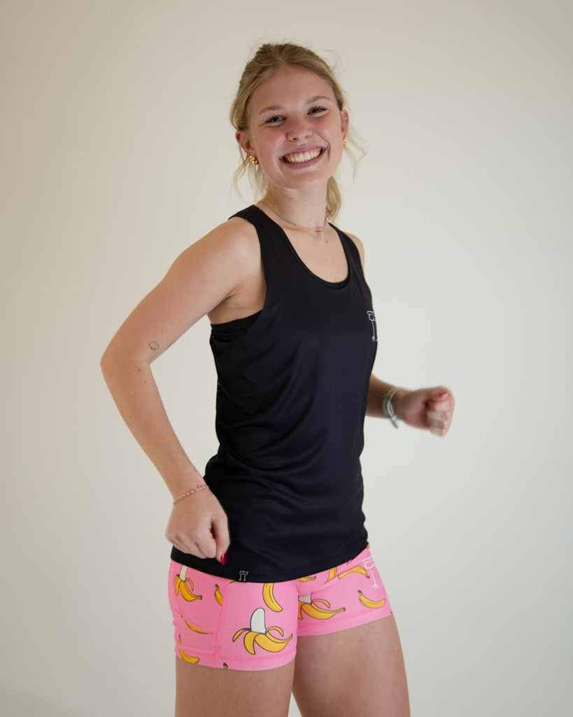 Runner is wearing ChicknLegs in the women's performance singlet in the solid black design.