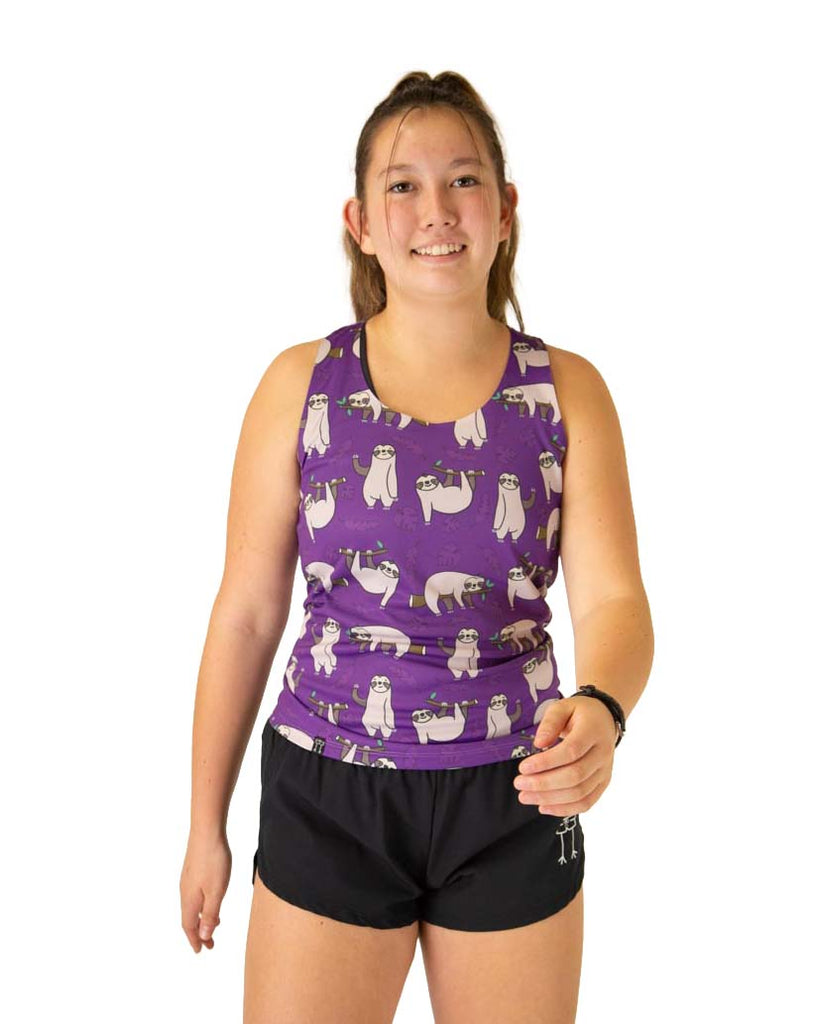 Runner is wearing ChicknLegs in the women's performance singlet in the sloth design. The print has sloths all over it with a purple background and leaves.