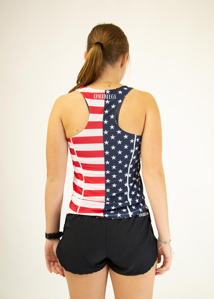 The model is a runner who is wearing Chicknlegs women's singlet in the USA design, facing away from the camera to show the back of the singlet.