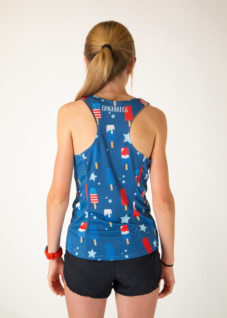 Runner is wearing ChicknLegs in the women's performance singlet in the USA Popsicle singlet. The print has ice cream all over it in red white and blue in breathable mesh and material.