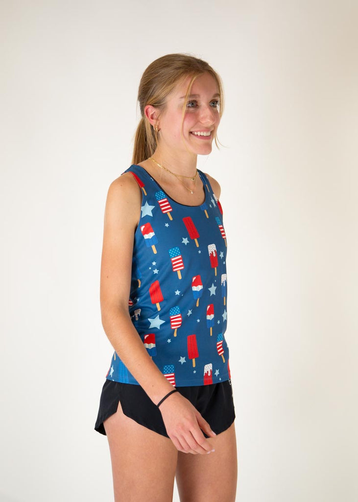 Runner is wearing ChicknLegs in the women's performance singlet in the USA Popsicle singlet. The print has ice cream all over it in red white and blue with fun stars.